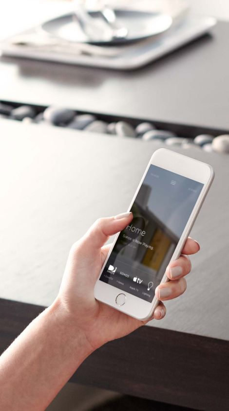 Savant home screen interface, hand holding phone