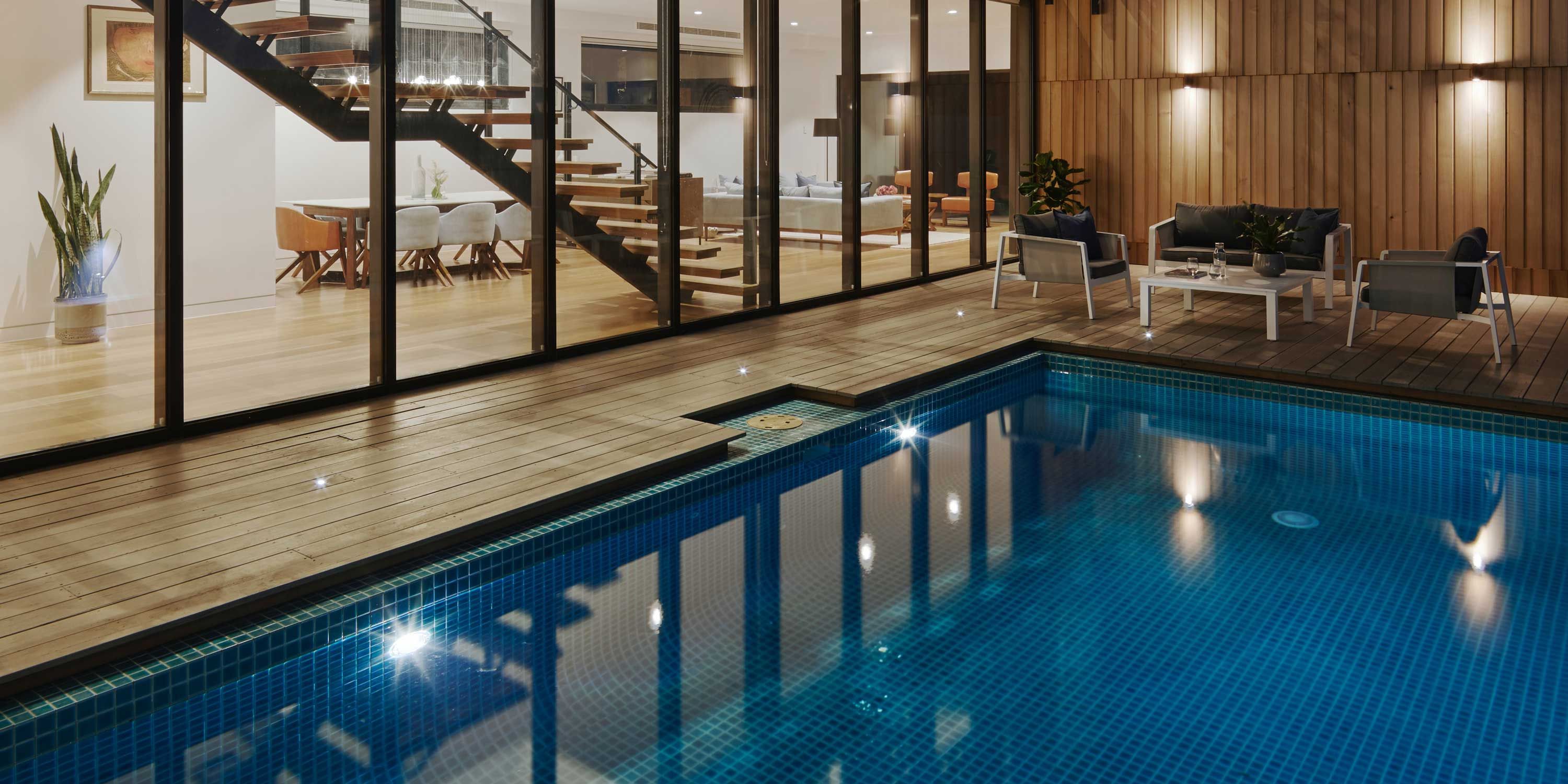 Tile pool, wood paneling, large windows